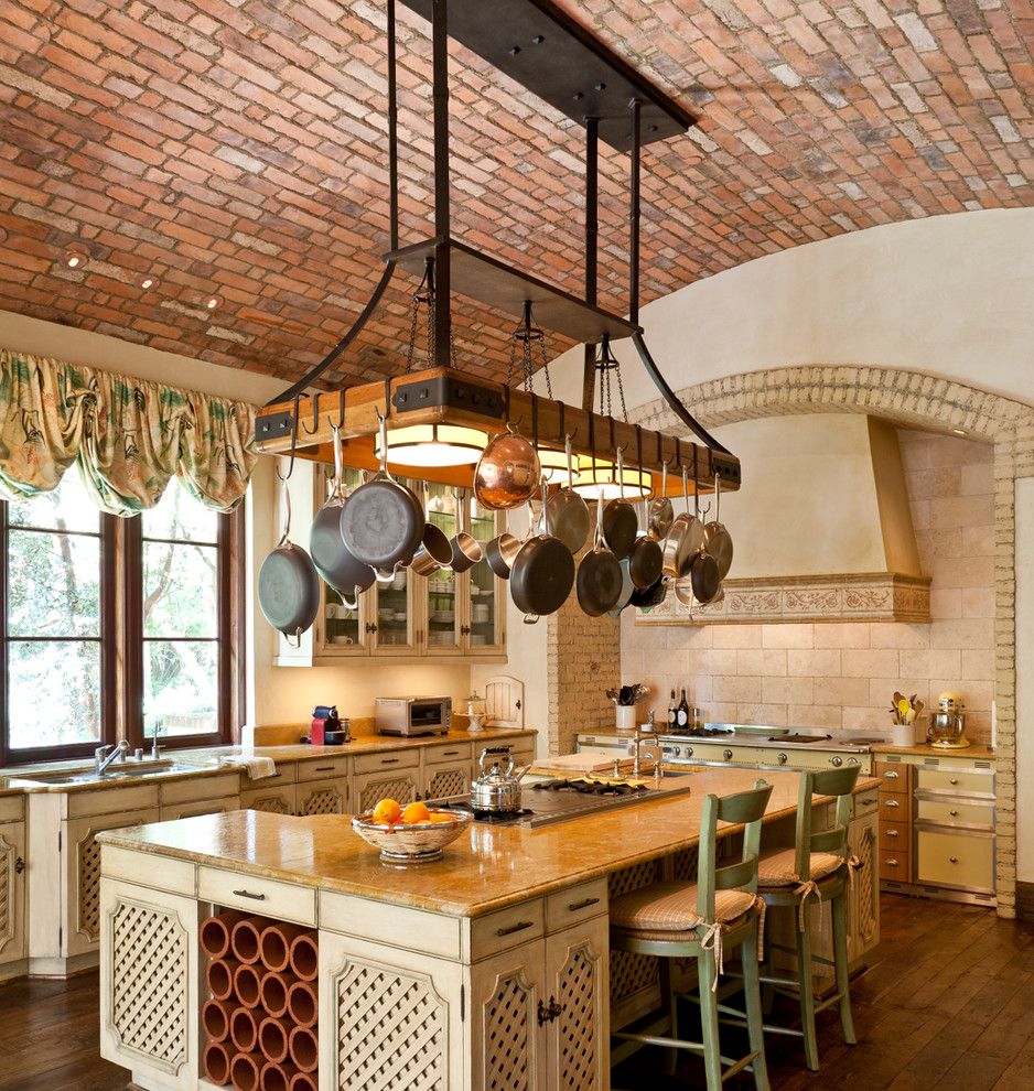 Hooks And Lattice For A Mediterranean Kitchen With A Brick And