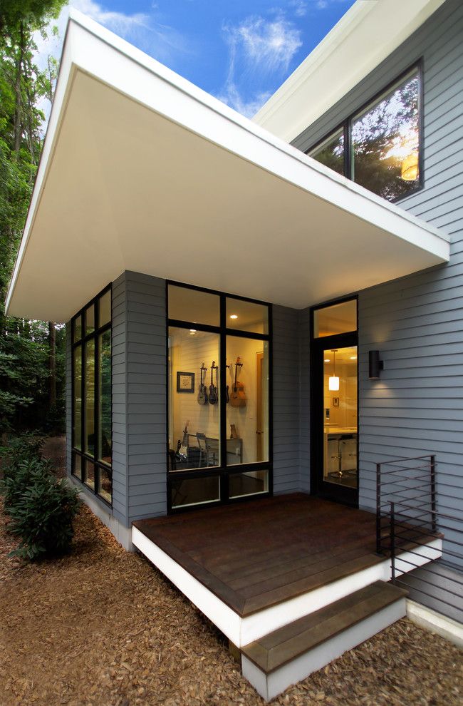 A1 Mulch for a Contemporary Exterior with a Windows and Riverside Residence by Moore Architects, Pc