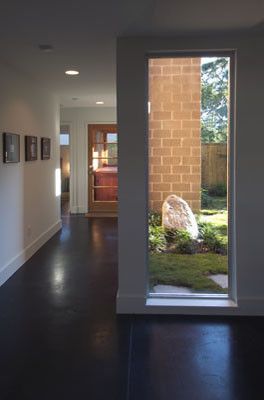 Acid Stained Concrete for a Asian Entry with a Stained Concrete and Courtyard by Rod Collins Architecture and Construction