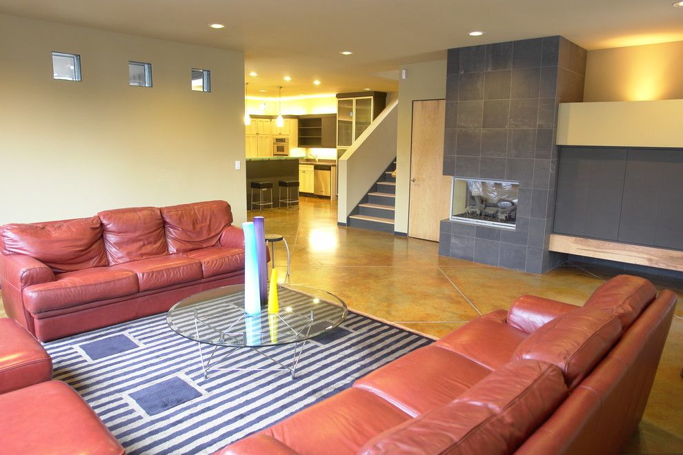 Acid Wash Concrete for a Contemporary Living Room with a Staircase and Alley House I : Custom Home by John Webb Construction and Design