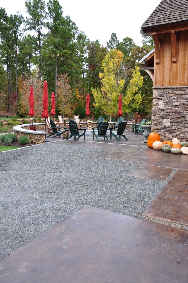 Acid Wash Concrete for a Traditional Landscape with a Stained Concrete and Barn Fire Pit Terrace by the Collins Group/jdp Design