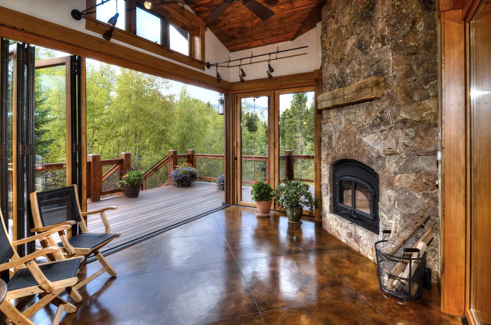 Acid Washed Concrete for a Contemporary Porch with a Wood Deck and Royal Tiger by Equinox Architecture Llc