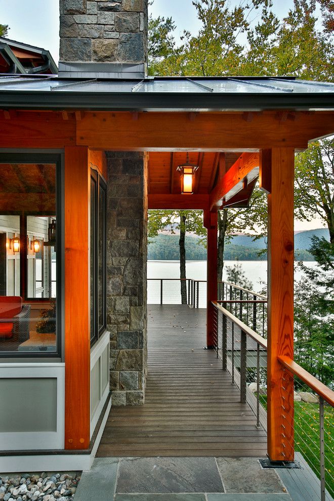 Adair Homes for a Rustic Deck with a Rustic and Bolton Landing Modern Cabin by Teakwood Builders, Inc.