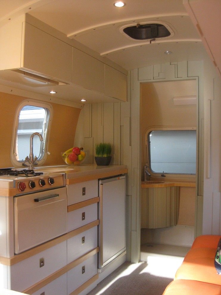 Airstream Renovation for a Midcentury Kitchen with a Airstream Renovation and 1971 Airstream by Amy Carman Design