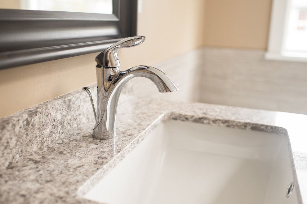 Aker Tubs for a Contemporary Bathroom with a His and Hers and Rich Transformation by Alderidge Construction Ltd.