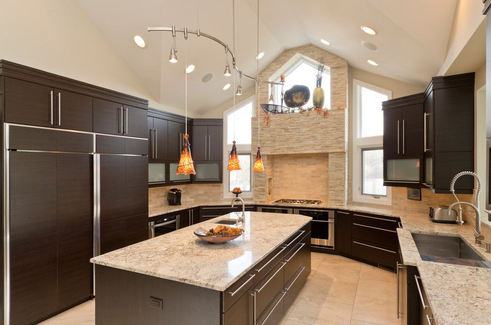 Alaskan White Granite for a Contemporary Kitchen with a Beige Wall and Kitchens by Bradford and Kent