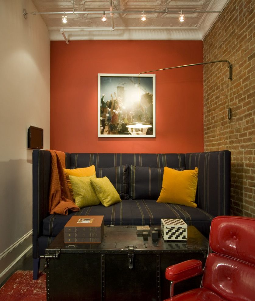 Alphera Financial Services for a Industrial Family Room with a Orange Paint and David Howell Design by David Howell Design