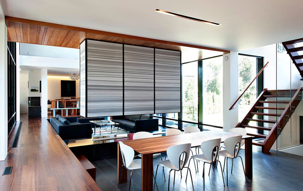 Altius for a Contemporary Dining Room with a U Shaped Staircase and Thorncrest House by Altius Architecture, Inc.