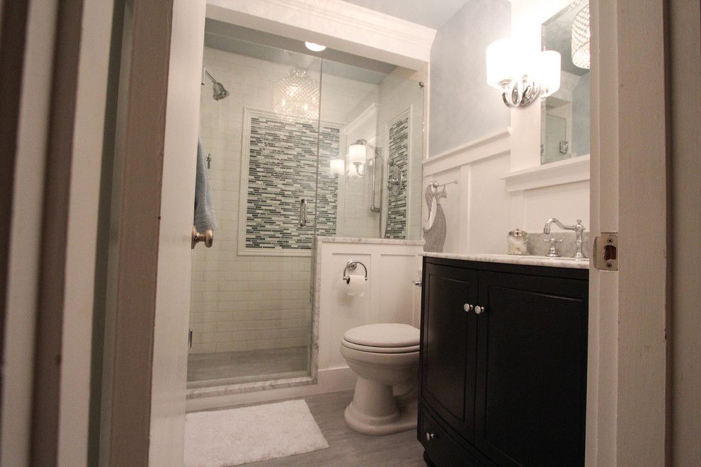 Anatolia Tile for a Traditional Bathroom with a American Standard and Reading Bathroom Remodel by Essence Design Studios