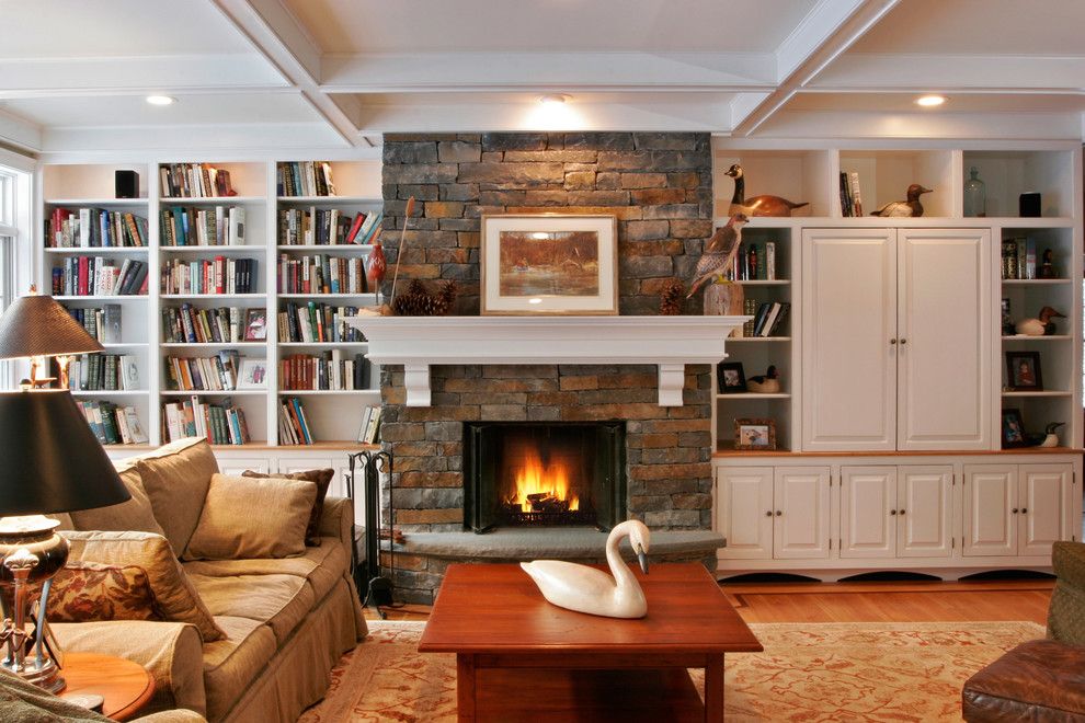 Annapolis Lighting for a Traditional Family Room with a Bookshelves and the Way You Live by Teakwood Builders, Inc.