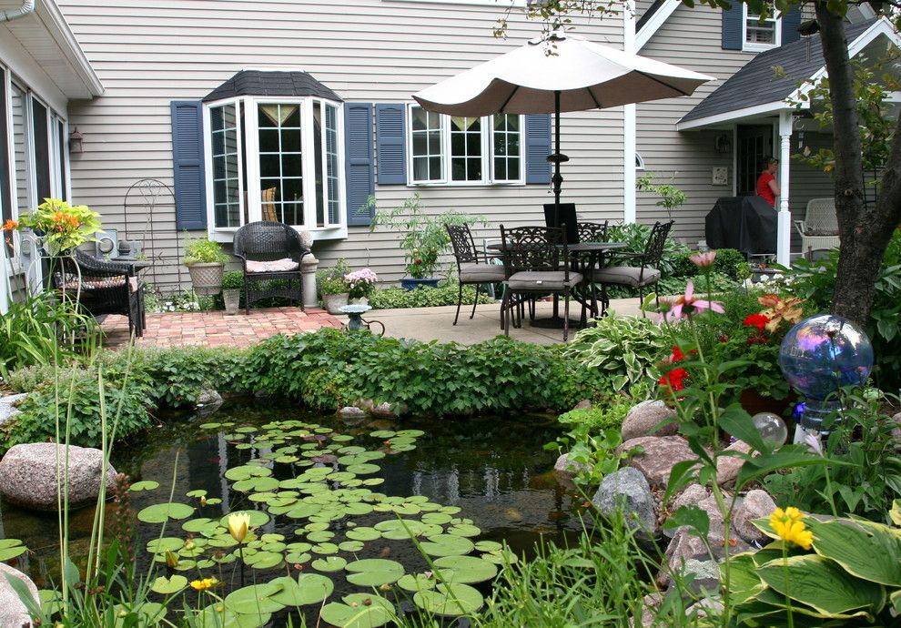 Aquascape for a Traditional Landscape with a Outdoor Dining and Outdoor Living with Water Gardens by Aquascape Inc.