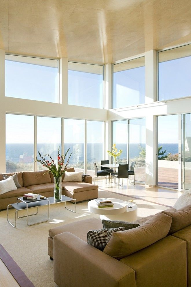 Arcadia Doors for a Modern Living Room with a Large Window and Oceanview Living by Zeroenergy Design