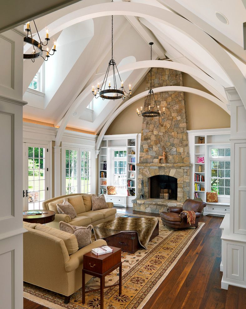 Arcadia Furniture for a Traditional Family Room with a Tall Fireplace and Family Rooms by Jan Gleysteen Architects, Inc