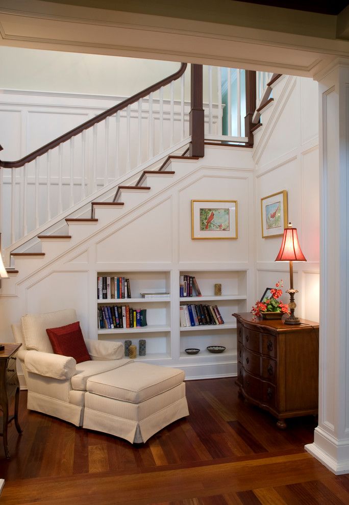 Architrave for a Traditional Entry with a Armchair and Bookcase by the Williams Group Inc.