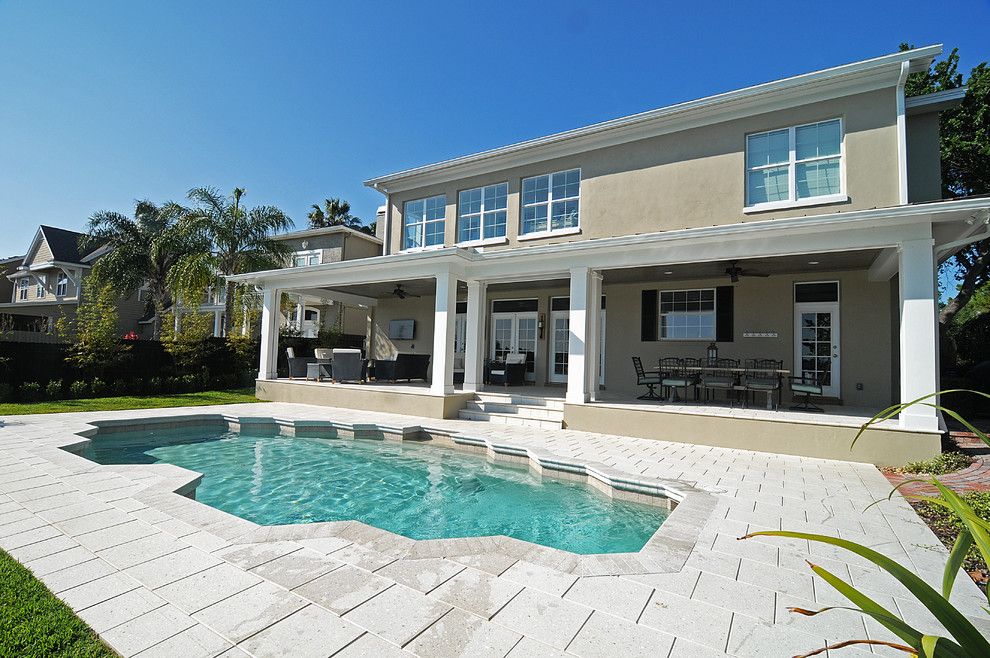 Artistic Pavers for a Traditional Spaces with a Pine Ceiling and College Park Porch / Lanai by Basso Homes Inc