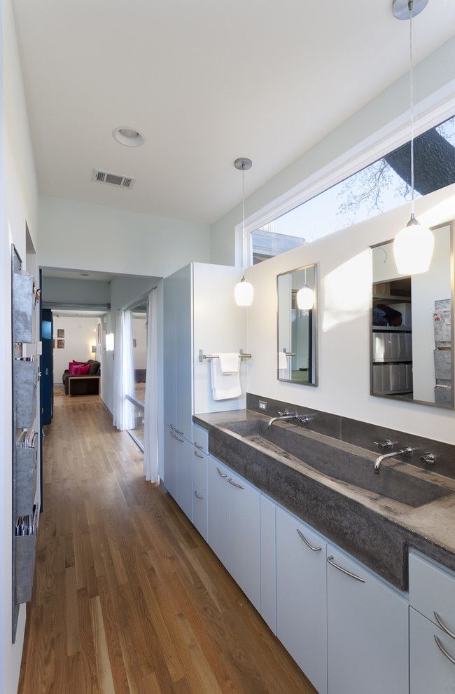 Asphalt vs Concrete for a Contemporary Bathroom with a Picture Window and Under Tree House by Loop Design