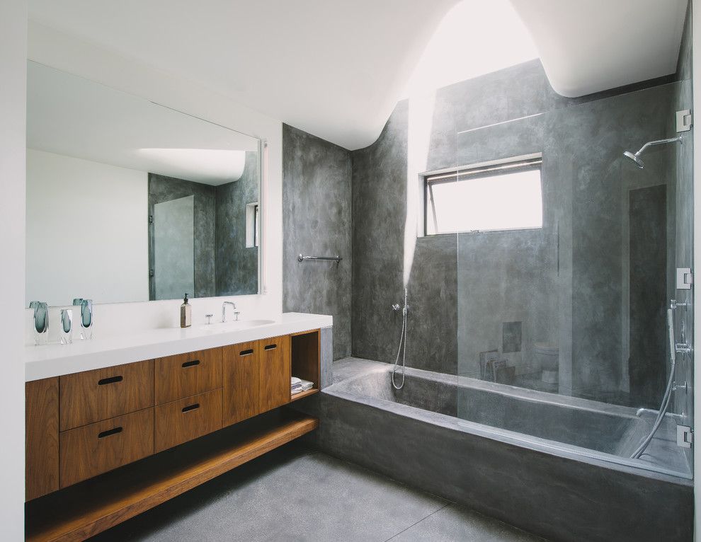 Asphalt vs Concrete for a Modern Bathroom with a Bathtub and Green Greenberg Green House by New Theme Inc.