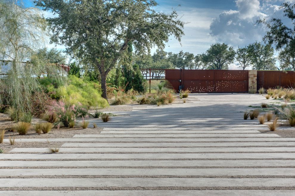 Asphalt vs Concrete for a Modern Landscape with a Rust and Portfolio by D Crain Design and Construction