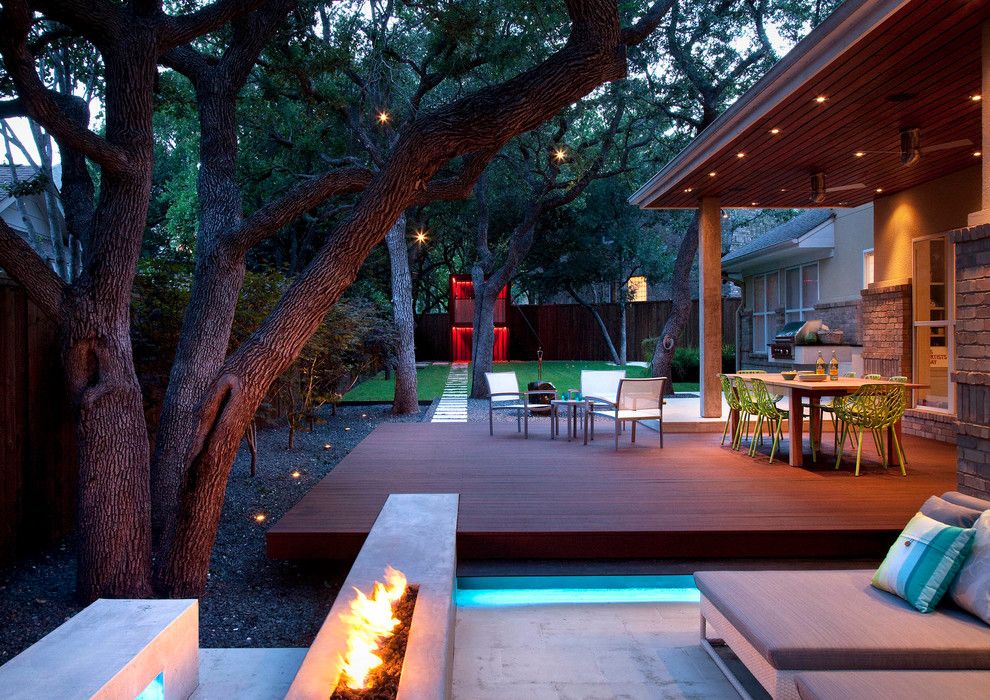 Backyard Masters for a Contemporary Landscape with a Stone Patio and Live Eat Relax and Play in the Back Yard by Austin Outdoor Design