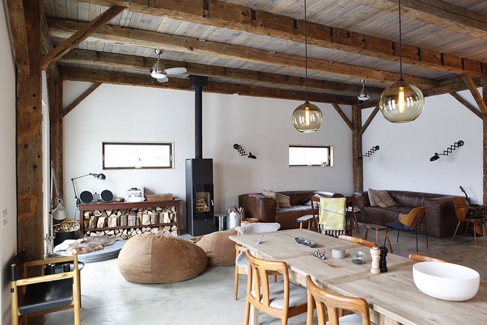 Bacons Furniture for a Rustic Living Room with a Sconce and Bovina House by Kimberly Peck Architect