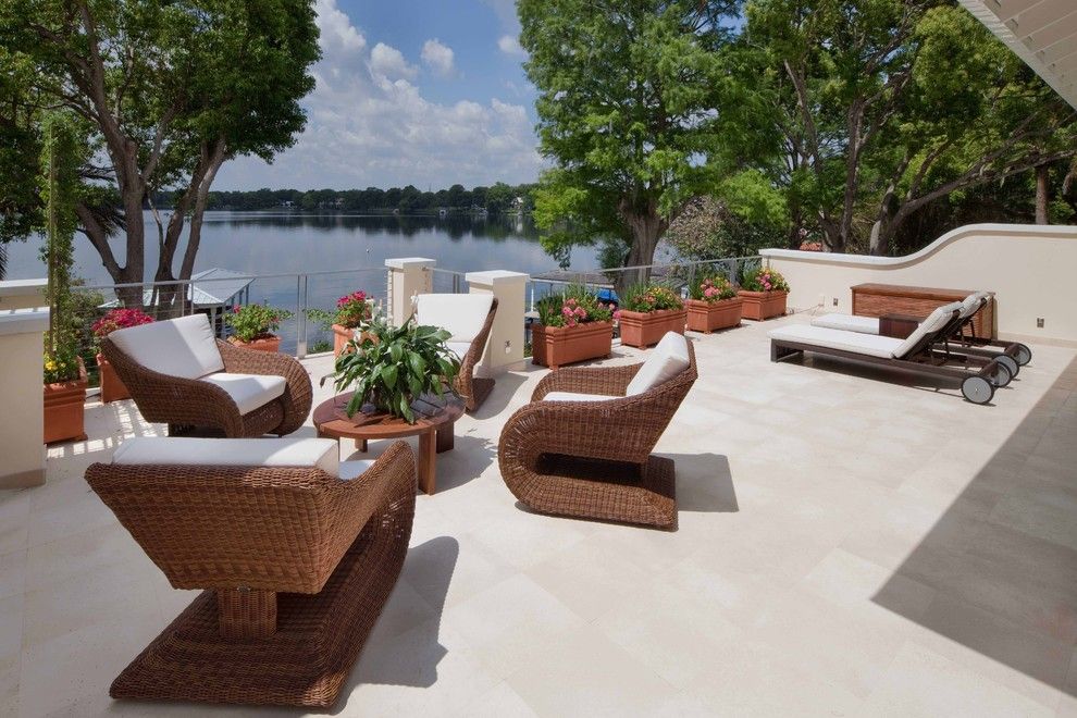 Bacons Furniture for a Tropical Patio with a Lake and La Belle by Phil Kean Design Group