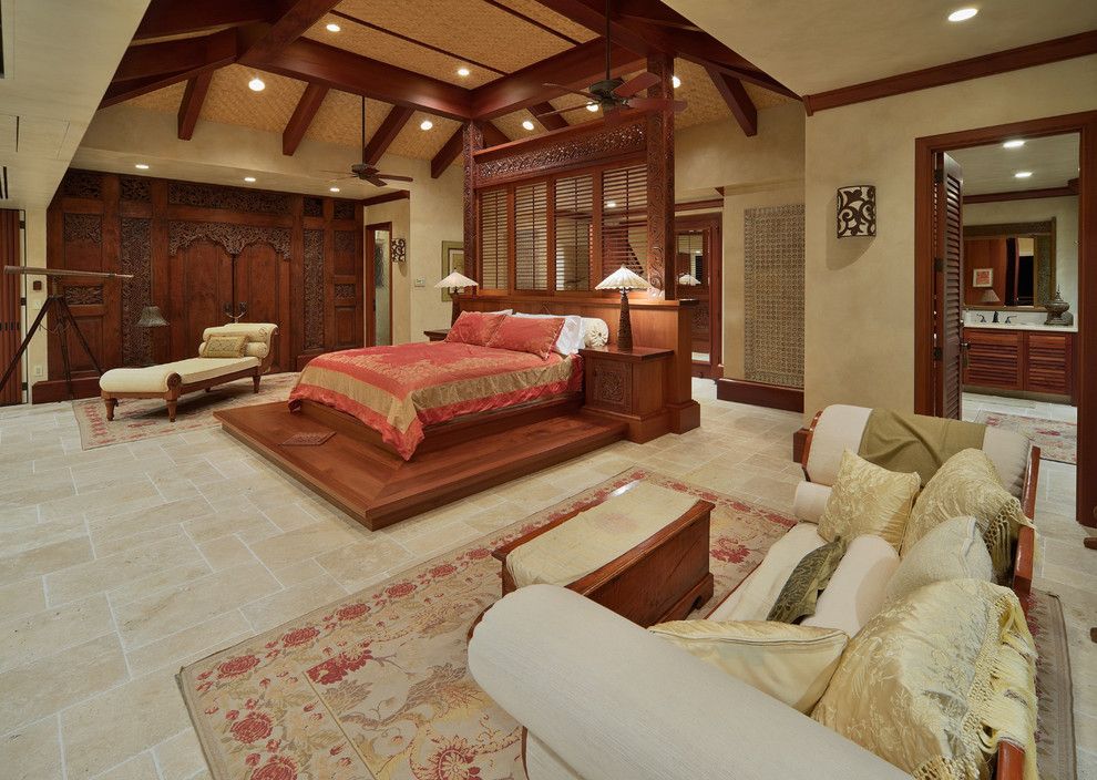 Balis for a Tropical Bedroom with a Carved Wood Bed and Bali House by Rick Ryniak Architects