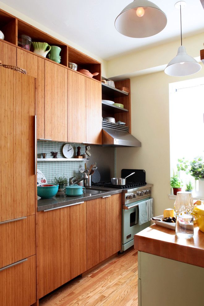 Bamboo vs Hardwood for a Eclectic Kitchen with a Kitchen Tile and Village Apartment Nyc by Moment Design + Productions, Llc