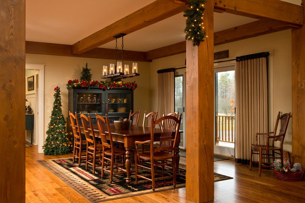 Bare Bones Furniture for a Traditional Dining Room with a Area Rug and Rustic Refined by Teakwood Builders, Inc.