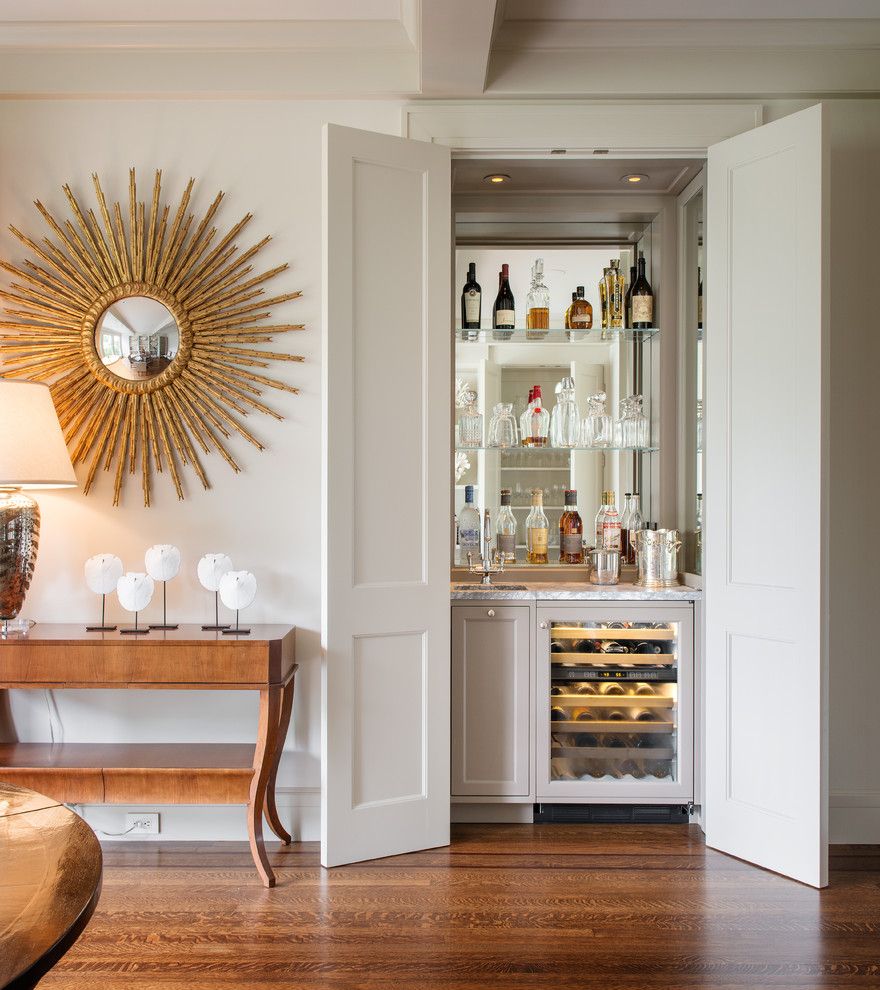 Bassett Mirror Company for a Transitional Home Bar with a Beige Wall and Clay Street by Sutro Architects