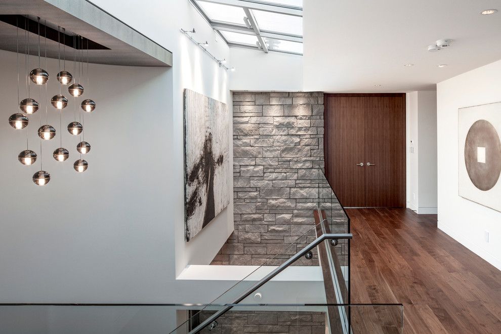 Bedrock Granite for a Contemporary Hall with a Double Door and Waterfront Spectacular by Schmidt Architecture