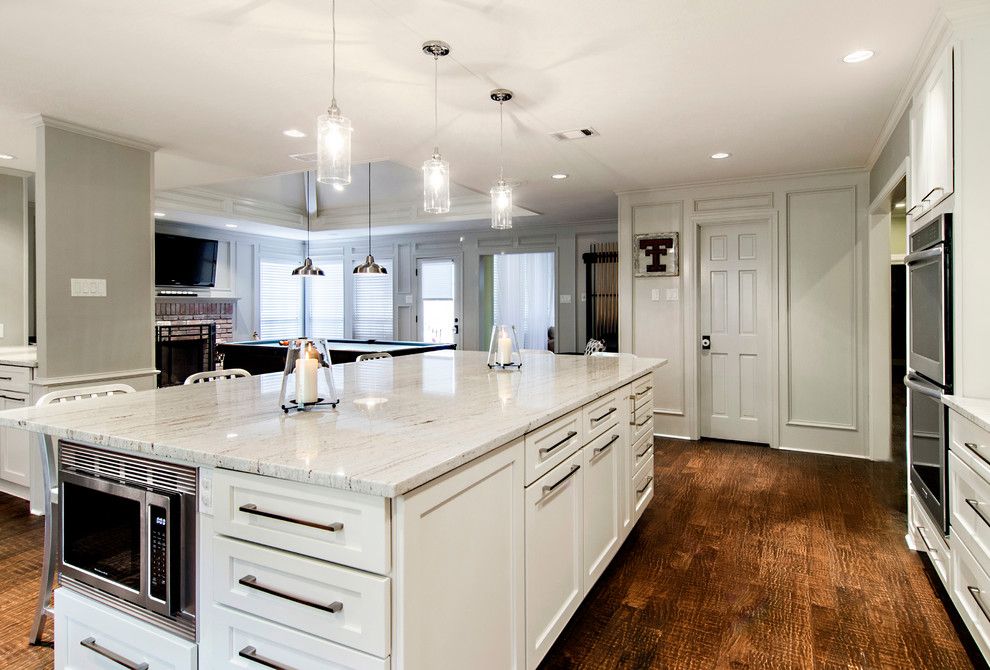 Bedrock Granite for a Transitional Kitchen with a Large Island and Looking at the Family Room and New Pantry by Hatfield Builders & Remodelers