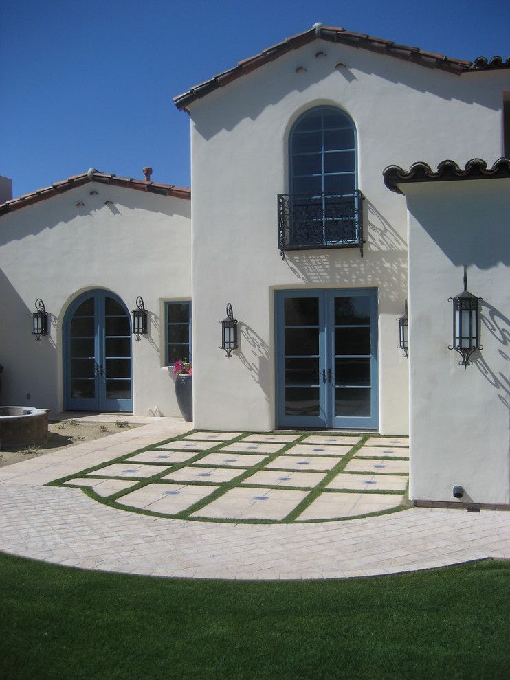 Behr Swiss Coffee for a Mediterranean Exterior with a Blue Door and Carson Poetzl, Inc. by Carson Poetzl, Inc.