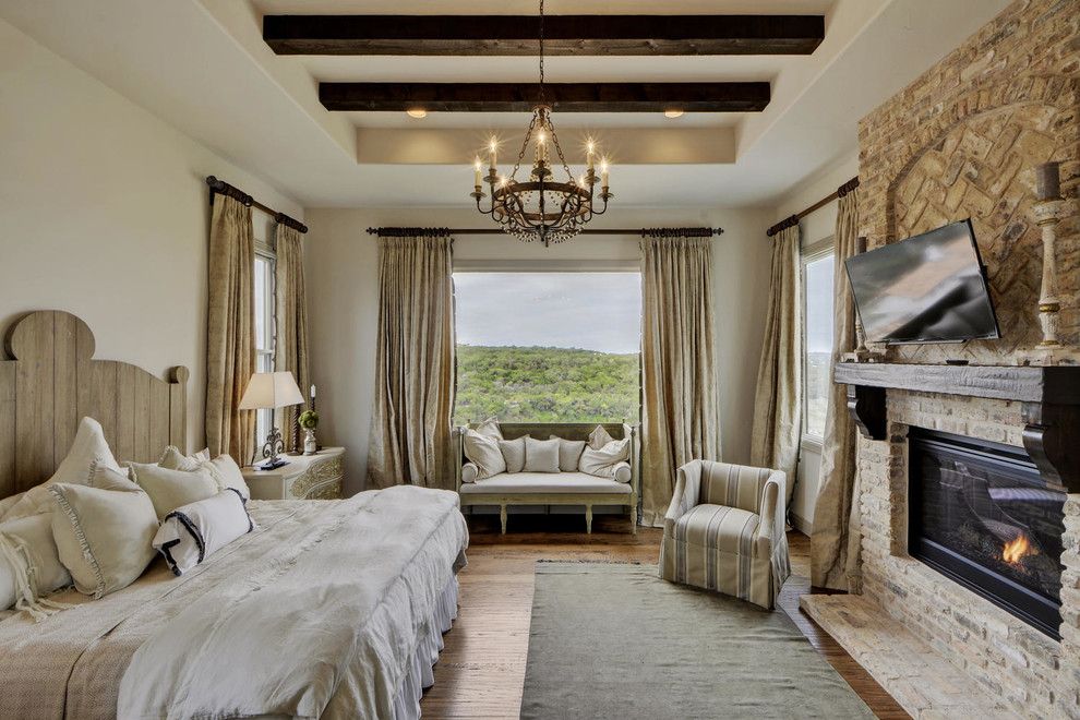 Bella Vita Custom Homes for a Mediterranean Bedroom with a Dark Wood Beams and Rough Hollow by Bella Vita Custom Homes & Remodeling