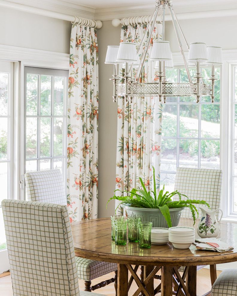 Benjamin Moore Manchester Tan for a Traditional Dining Room with a Light Hardwood Flooring and New England Shingle Style by Hamilburg Interiors