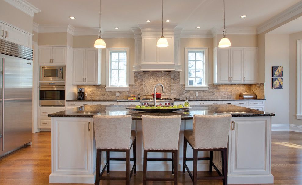 Benjamin Moore Muslin for a Traditional Kitchen with a Wood Floor and Elbow Park by Caniela Design