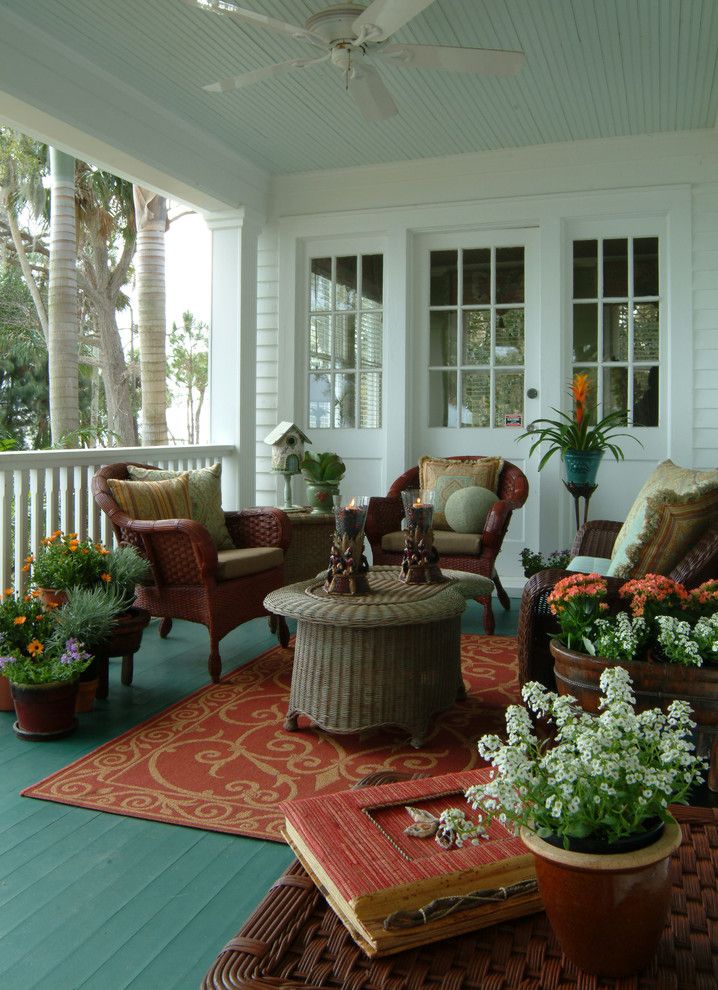 Benjamin Moore Quiet Moments for a Eclectic Porch with a Wicker Chair and Old Florida River House by Island Paint and Decorating