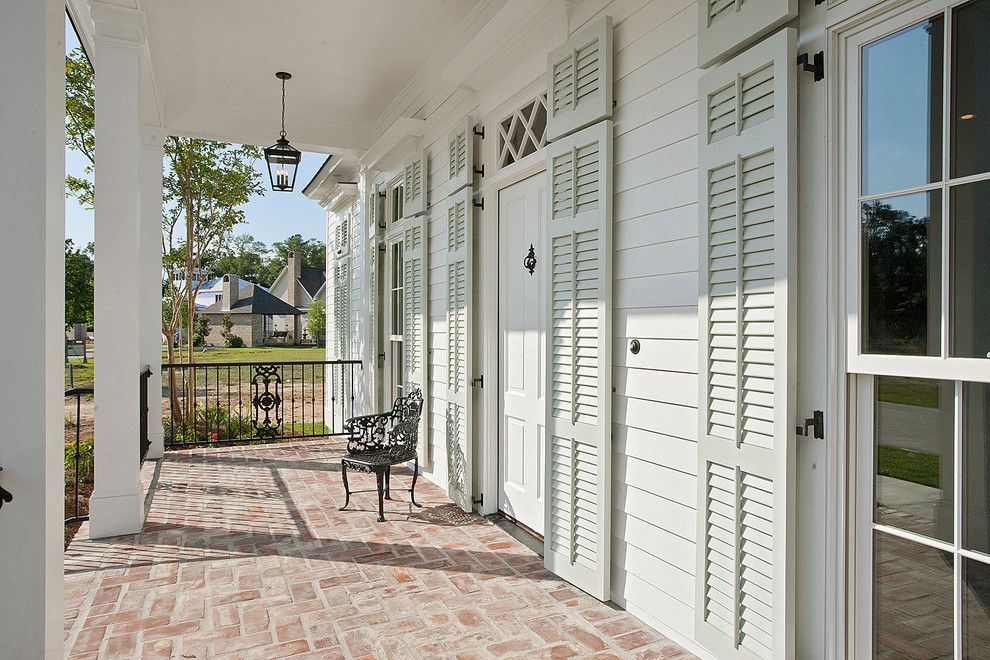 Benjamin Moore Sea Salt for a Traditional Porch with a Shutters and New Orleans Charm with a Private Courtyard by Highland Homes, Inc.