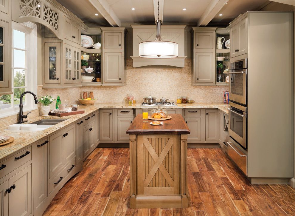 Benjamin Moore Shaker Beige for a Contemporary Kitchen with a Butcher Block Island and Wellborn Cabinet by Wellborn Cabinet, Inc.