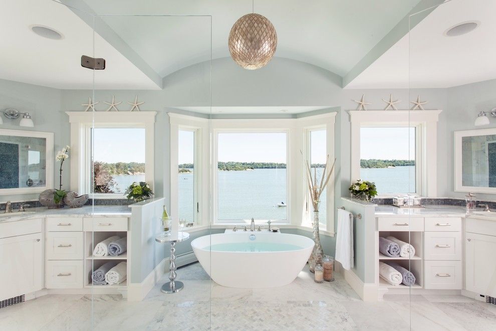 Benjamin Moore Smoke for a Beach Style Bathroom with a Designer Bathroom and a Master Bathroom with a View by Roomscapes Luxury Design Center