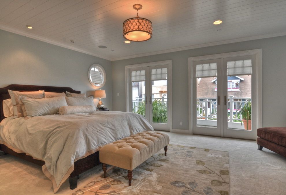 Benjamin Moore Swiss Coffee for a Traditional Bedroom with a Porthole Window and Freestone Residence by Luann Development, Inc.