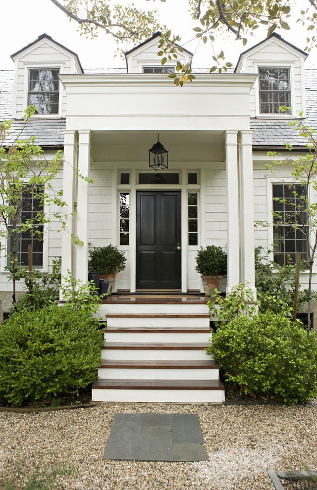 Benjamin Moore Swiss Coffee for a Traditional Exterior with a Black Front Door and Rustic Canyon New Home by Tim Barber Ltd Architecture