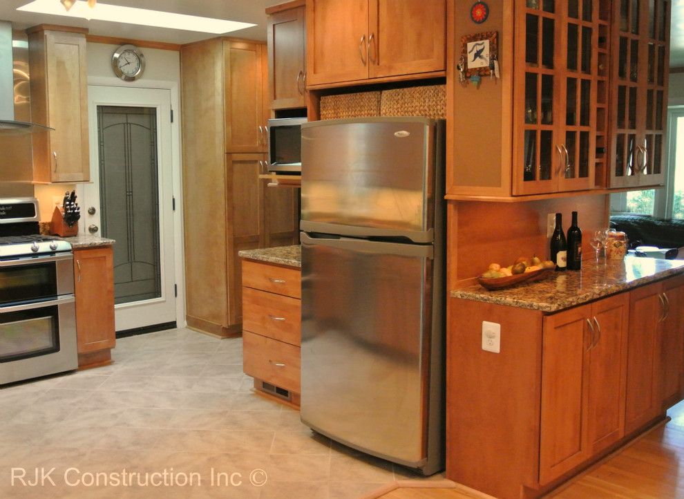 Bertch for a Traditional Kitchen with a Stainless Steel Sink and Bertch Kitchen with Sunroom by Rjk Construction Inc