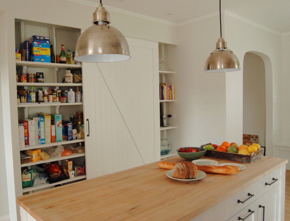 Better Built Barns for a Farmhouse Kitchen with a White and Pantry with Barn Door by Rebekah Zaveloff | Kitchenlab