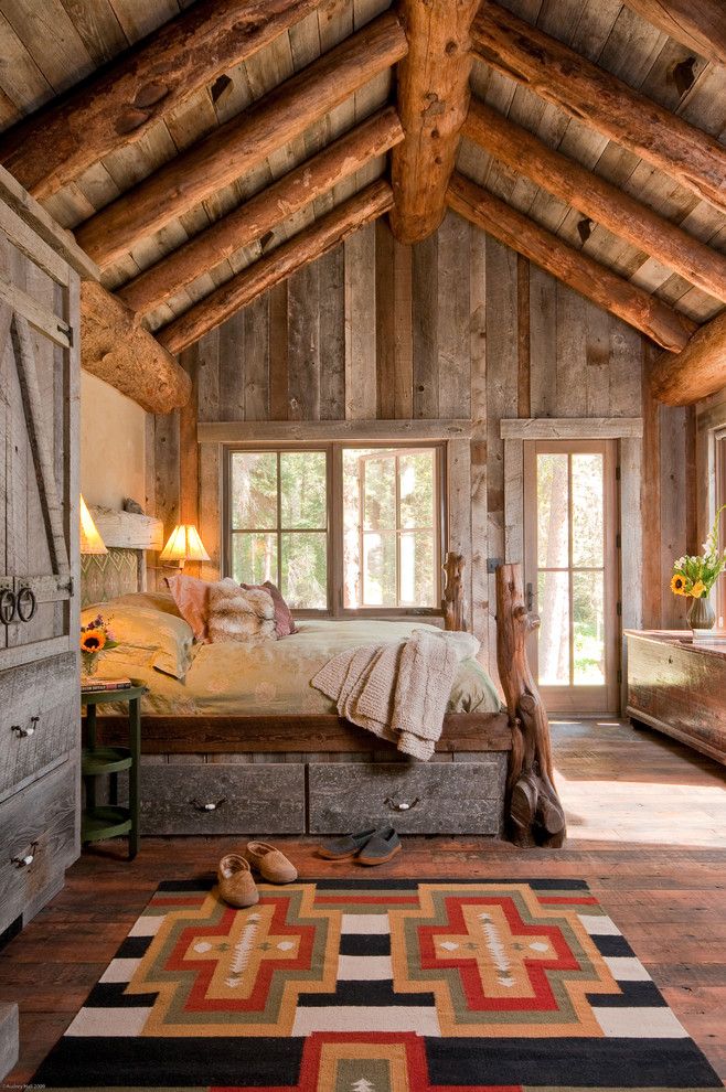 Big Sky Brokers for a Rustic Bedroom with a Exposed Timbers and Headwaters Camp Cabin, Big Sky, Montana by Dan Joseph Architects, Llc