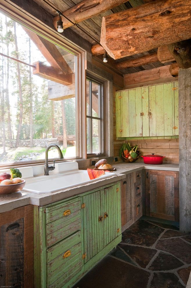 Big Sky Brokers for a Rustic Kitchen with a Rustic Wood and Headwaters Camp Cabin, Big Sky, Montana by Dan Joseph Architects, Llc