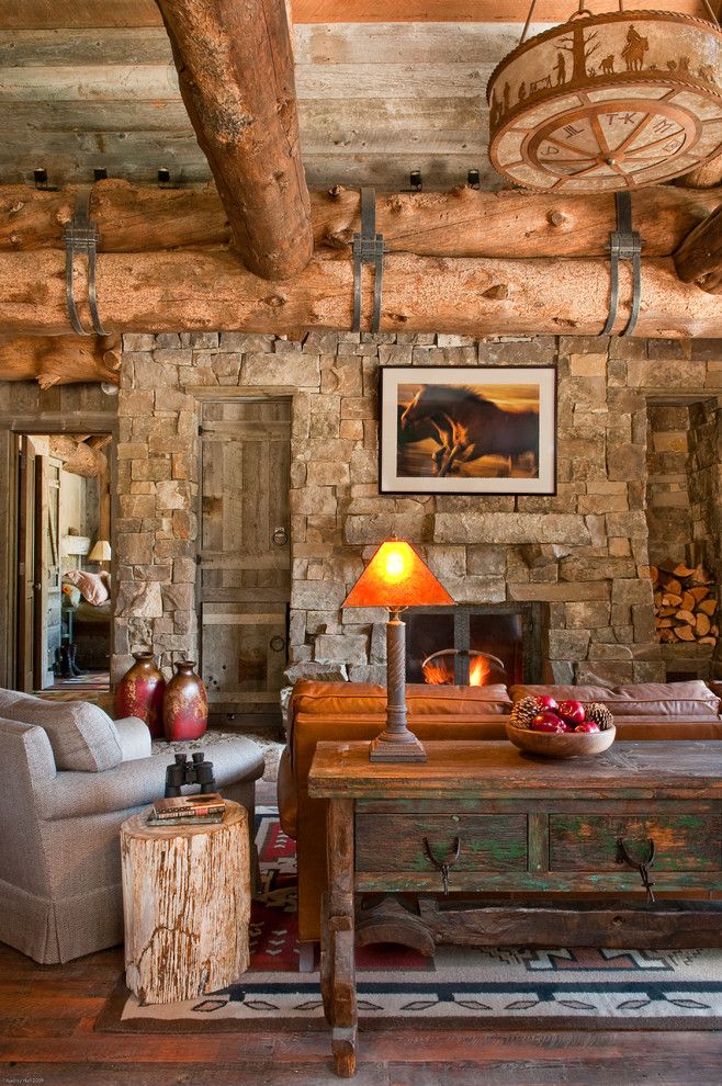 Big Sky Brokers for a Rustic Living Room with a Wood Bowl and Headwaters Camp Cabin, Big Sky Montana by Dan Joseph Architects, Llc