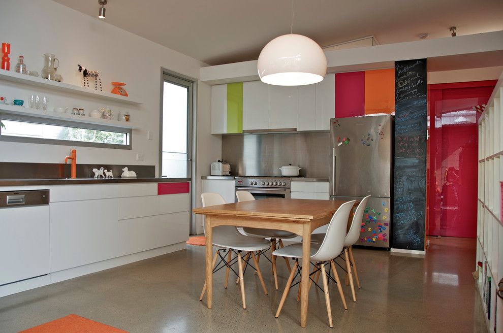 Bill Smith Appliances for a Eclectic Kitchen with a Light Wood Dining Table and Colorful Kitchen by Jeni Lee