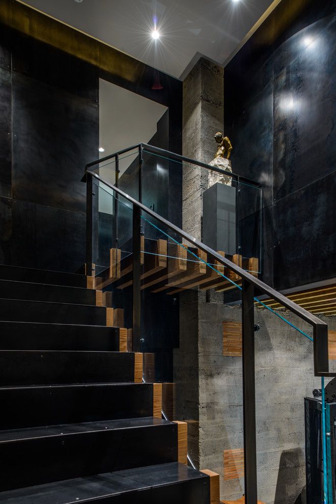 Blackened Steel for a Contemporary Staircase with a Glass Railing and Duchess Mansion by Garret Cord Werner Architects & Interior Designers