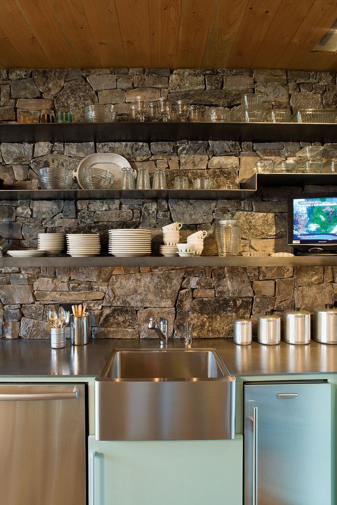 Blackened Steel for a Rustic Kitchen with a Water and Stone Creek Camp by Andersson Wise Architects