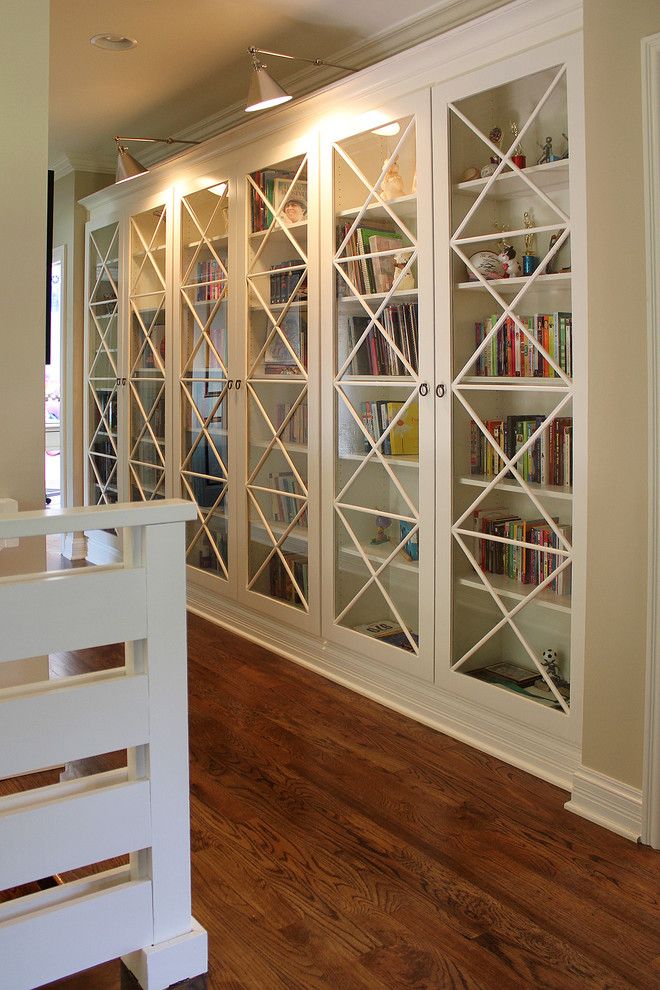 Bleeker Beige for a Transitional Family Room with a Wood Floor and Bookcases by Stacy Jacobi